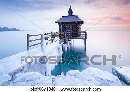 Iced wooden bathhouse at sunrise on Lake Neuchâtel in Gorgier, Neuchâtel, Switzerland, Europe View Large Photo Image Stock Image - Iced wooden bathhouse at sunrise on Lake Neuchâtel in Gorgier, Neuchâtel, Switzerland, Europe. Fotosearch