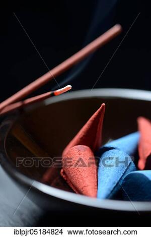 Incense cones in bowl and burning incense sticks, incense candle View Large Photo Image Picture - Incense cones in bowl and burning incense sticks, incense candle. Fotosearch