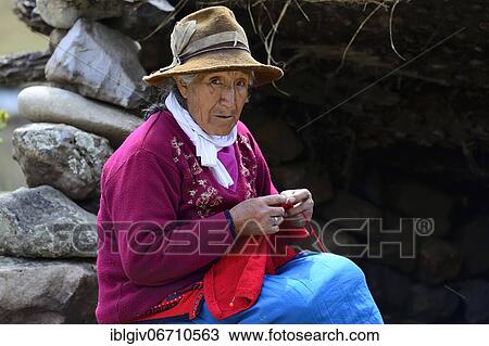 Stock Image - Indigenous old woman knitting, Cordillera Blanca, Recuay Province, Peru, South America. Fotosearch