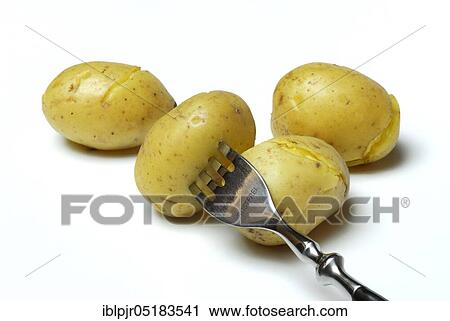Stock Image - Jacket potato with fork, potatoes, boiled, cooked. Fotosearch
