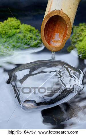 Japanese fountain, bamboo cane View Large Photo Image Stock Photo - Japanese fountain, bamboo cane. Fotosearch