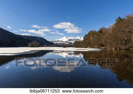 Lake Chambon in winter, Massif of Sancy in the background, Regional Nature Park of the Volcanoes of Auvergne, Puy de Dome department, Auvergne, France, Europe View Large Photo Image Stock Image - Lake Chambon in winter, Massif of Sancy in the background, Regional Nature Park of the Volcanoes of Auvergne, Puy de Dome department, Auvergne, France, Europe. Fotosearch