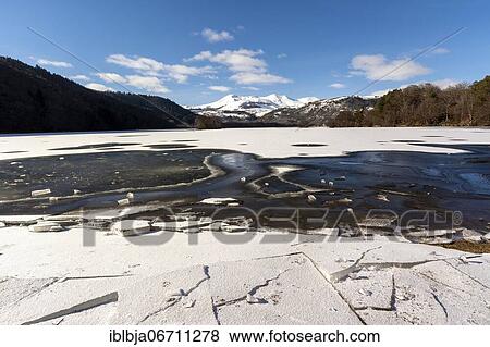 Lake Chambon in winter, Massif of Sancy in the background, Regional Nature Park of the Volcanoes of Auvergne, Puy de Dome department, Auvergne, France, Europe View Large Photo Image Stock Photo - Lake Chambon in winter, Massif of Sancy in the background, Regional Nature Park of the Volcanoes of Auvergne, Puy de Dome department, Auvergne, France, Europe. Fotosearch