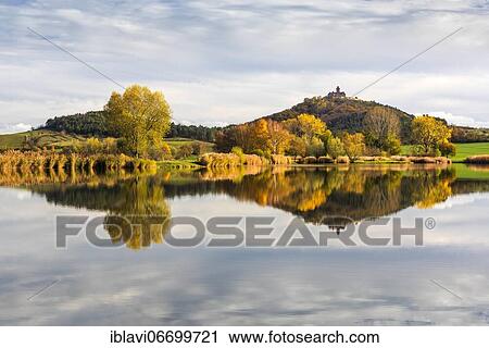 Landscape with lake in autumn, Veste Wachsenburg reflected, castle of the castle ensemble Drei Gleichen, Mühlberg, Thuringia, Germany, Europe View Large Photo Image Stock Image - Landscape with lake in autumn, Veste Wachsenburg reflected, castle of the castle ensemble Drei Gleichen, Mühlberg, Thuringia, Germany, Europe. Fotosearch