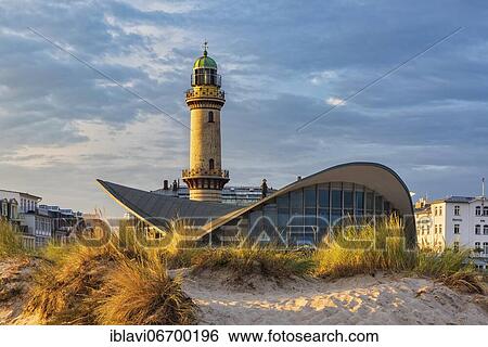 Stock Photograph - Lighthouse, restaurant Teepott and dunes with beach grass, morning light, Warnemünde, Hanseatic City of Rostock, Mecklenburg-Western Pomerania, Germany, Europe. Fotosearch