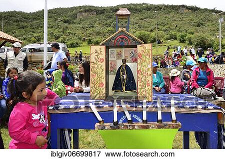 Stock Photo - Little indigenous girl looking at a shrine during a folk festival, Kuelap, Luya province, Amazonas region, Peru, South America. Fotosearch