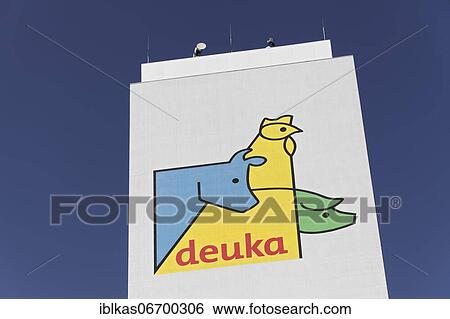 Stock Photograph - Logo Deuka animal feed at a silo, drawn figures cattle, chicken, pig, Neuss, North Rhine-Westphalia, Germany, Europe. Fotosearch