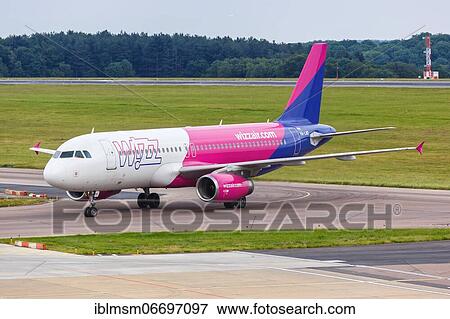Stock Photo - Luton (LTN), July 8, 2019: A Wizzair Airbus A320 with registration number HA-LWD at London Luton Airport in the United Kingdom, United Kingdom, Europe. Fotosearch