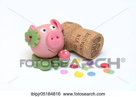 Stock Photograph - Marzipan lucky pig, and champagne cork, marzipan pig. Fotosearch