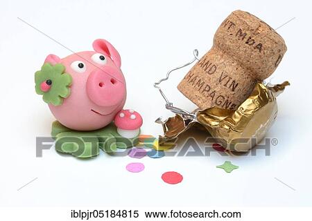 Stock Photography - Marzipan lucky pig, and champagne cork, marzipan pig. Fotosearch