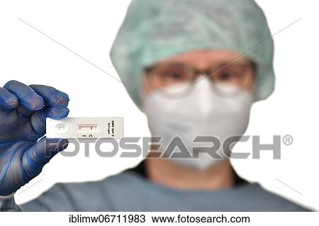Medical staff shows negative antigen rapid test, test cassette, Corona crisis, Germany, Europe View Large Photo Image Stock Image - Medical staff shows negative antigen rapid test, test cassette, Corona crisis, Germany, Europe. Fotosearch