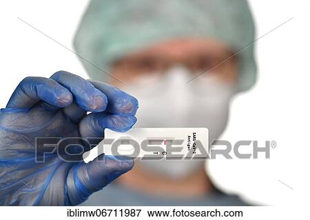 Medical staff shows negative antigen rapid test, test cassette, Corona crisis, Germany, Europe View Large Photo Image Stock Photo - Medical staff shows negative antigen rapid test, test cassette, Corona crisis, Germany, Europe. Fotosearch