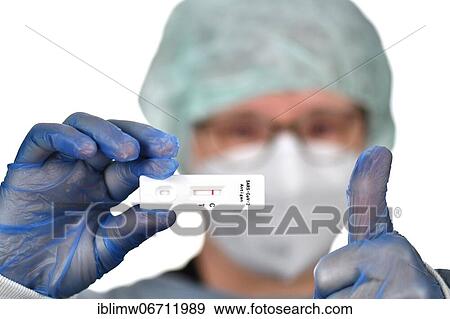Medical staff shows negative antigen rapid test, thumbs up, gestures, test cassette, Corona crisis, Germany, Europe View Large Photo Image Stock Photo - Medical staff shows negative antigen rapid test, thumbs up, gestures, test cassette, Corona crisis, Germany, Europe. Fotosearch