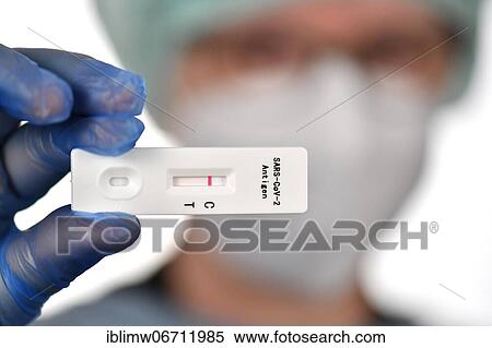 Medical staff shows negative antigen rapid test, test cassette, Corona crisis, Germany, Europe View Large Photo Image Stock Photography - Medical staff shows negative antigen rapid test, test cassette, Corona crisis, Germany, Europe. Fotosearch