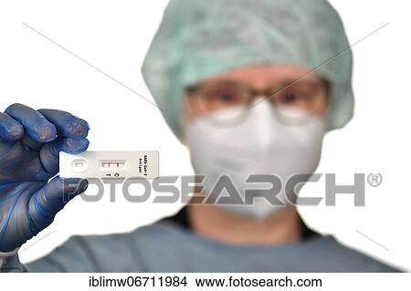 Medical staff shows positive antigen rapid test, test cassette, Corona crisis, Germany, Europe View Large Photo Image Picture - Medical staff shows positive antigen rapid test, test cassette, Corona crisis, Germany, Europe. Fotosearch