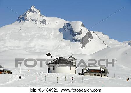Stock Photography - Melchsee-Frutt, chapel and houses on the Tannalp, skiing area in the Swiss Alps, Canton Obwalden, Switzerland, Europe. Fotosearch