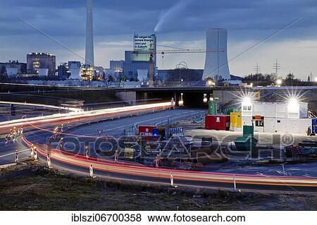 Stock Photo - Motorway junction A 43 with A 42 with power station Herne and construction site in the evening, Herne, Ruhr area, North Rhine-Westphalia, Germany, Europe. Fotosearch