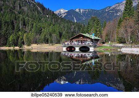 Mountain lake, inn, hiking area, Pflegersee, Bavaria, Werdenfels, Garmisch-Partenkirchen, Germany, Europe View Large Photo Image Stock Photo - Mountain lake, inn, hiking area, Pflegersee, Bavaria, Werdenfels, Garmisch-Partenkirchen, Germany, Europe. Fotosearch