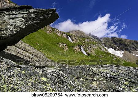 Picture - Mountain meadow, scree field, waterfall, at the Glockner reservoir, Carinthia, Austria, Europe. Fotosearch