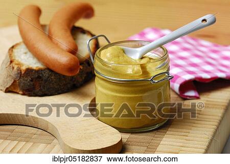 Mustard jar, mustard, sausages on bread, Vienna sausages, chopping board, spice View Large Photo Image Stock Photo - Mustard jar, mustard, sausages on bread, Vienna sausages, chopping board, spice. Fotosearch