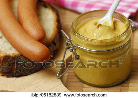 Mustard jar, mustard, sausages on bread, Vienna sausages, chopping board, spice View Large Photo Image Stock Photo - Mustard jar, mustard, sausages on bread, Vienna sausages, chopping board, spice. Fotosearch