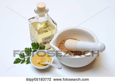 Stock Image - Mustard seed, yellow, in grating bowl, bowl with mustard, mustard seeds, mustard, mustard, table mustard, prepare mustard, mortar. Fotosearch