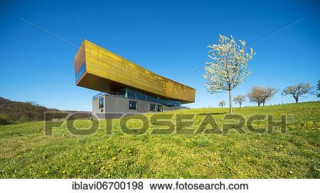 Nebra Ark in spring, flowering cherry tree, meadow with dandelion, Museum of the Sky Disk, Visitor Center, Nebra, Burgenlandkreis, Saxony-Anhalt, Germany, Europe View Large Photo Image Stock Photo - Nebra Ark in spring, flowering cherry tree, meadow with dandelion, Museum of the Sky Disk, Visitor Center, Nebra, Burgenlandkreis, Saxony-Anhalt, Germany, Europe. Fotosearch