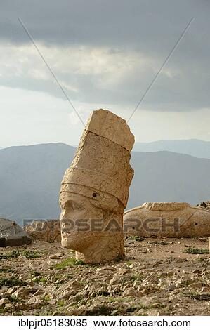 Stock Photography - Nemrut Dagi, Anatolia, Adiyaman Province, Kahta, Nemrud, stone head at the burial mound of King Antiochus, burial shrine, western terrace, stone head, Turkey, Asia. Fotosearch