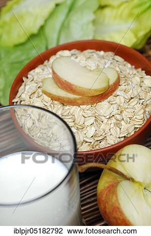 Oat flakes (Avena sativa), oats, muesli, apple slices, milk View Large Photo Image Stock Image - Oat flakes (Avena sativa), oats, muesli, apple slices, milk. Fotosearch