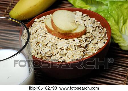 Oat flakes (Avena sativa), oats, muesli, apple slices, milk View Large Photo Image Stock Image - Oat flakes (Avena sativa), oats, muesli, apple slices, milk. Fotosearch