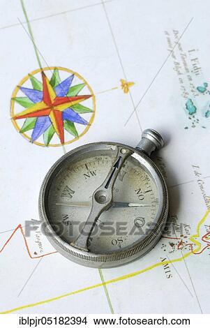 Old compass on map, orientation, discovery, explorer View Large Photo Image Picture - Old compass on map, orientation, discovery, explorer. Fotosearch