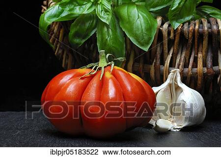Stock Image - Ox heart, ox heart (Solanum lycopersicum), Cuore di bue, meat, meatTomato, basil, garlic. Fotosearch