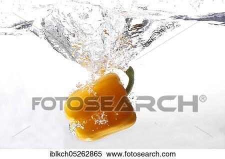Paprika falls into water View Large Photo Image Stock Photography - Paprika falls into water. Fotosearch