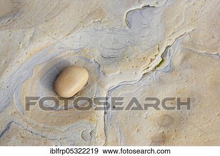 Stock Photo - Pebble on rock, rock detail. Fotosearch