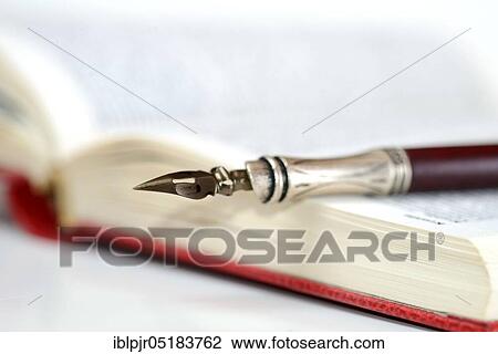 Stock Image - Penholder and book. Fotosearch