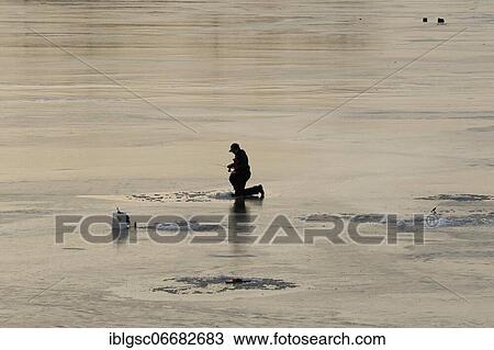 People fishing on frozen river, Province of Quebec, Canada, North America View Large Photo Image Stock Image - People fishing on frozen river, Province of Quebec, Canada, North America. Fotosearch