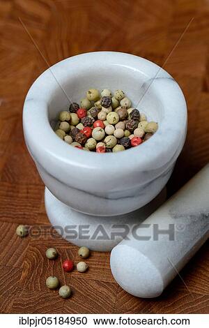 Stock Image - Peppercorns in grated shell, pepper, white, green, black ( Piper nigrum) and pink Pfef fer. Fotosearch