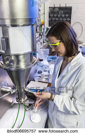 PhD student during her research work on a Hüttlin-Mycrolab machine (fluid bed granulator) at the Institute of Pharmaceutical Technology and Biopharmacy at Heinrich-Heine-University Düsseldorf, North Rhine-Westphalia, Germany, Europe View Large Photo Image Stock Photo - PhD student during her research work on a Hüttlin-Mycrolab machine (fluid bed granulator) at the Institute of Pharmaceutical Technology and Biopharmacy at Heinrich-Heine-University Düsseldorf, North Rhine-Westphalia, Germany, Europe. Fotosearch
