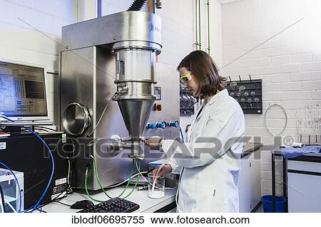 PhD student during her research work on a Hüttlin-Mycrolab machine (fluid bed granulator) at the Institute of Pharmaceutical Technology and Biopharmacy at Heinrich-Heine-University Düsseldorf, North Rhine-Westphalia, Germany, Europe View Large Photo Image Stock Photography - PhD student during her research work on a Hüttlin-Mycrolab machine (fluid bed granulator) at the Institute of Pharmaceutical Technology and Biopharmacy at Heinrich-Heine-University Düsseldorf, North Rhine-Westphalia, Germany, Europe. Fotosearch