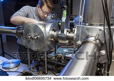 PhD student during his research work adjusting his experimental setup, laser laboratory of Prof. Georg Pretzler's group for laser and plasma physics at Heinrich-Heine-University, Düsseldorf, North Rhine-Westphalia, Germany, Europe View Large Photo Image Picture - PhD student during his research work adjusting his experimental setup, laser laboratory of Prof. Georg Pretzler's group for laser and plasma physics at Heinrich-Heine-University, Düsseldorf, North Rhine-Westphalia, Germany, Europe. Fotosearch