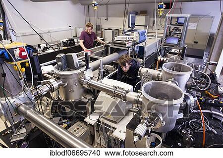 PhD student during his research work adjusting his experimental setup, laser laboratory of Prof. Georg Pretzler's working group for laser and plasma physics at Heinrich Heine University, Düsseldorf, North Rhine-Westphalia, Germany, Europe View Large Photo Image Stock Image - PhD student during his research work adjusting his experimental setup, laser laboratory of Prof. Georg Pretzler's working group for laser and plasma physics at Heinrich Heine University, Düsseldorf, North Rhine-Westphalia, Germany, Europe. Fotosearch