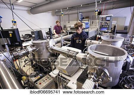 PhD student during his research work adjusting his experimental setup, laser laboratory of Prof. Georg Pretzler's working group for laser and plasma physics at Heinrich Heine University, Düsseldorf, North Rhine-Westphalia, Germany, Europe View Large Photo Image Stock Image - PhD student during his research work adjusting his experimental setup, laser laboratory of Prof. Georg Pretzler's working group for laser and plasma physics at Heinrich Heine University, Düsseldorf, North Rhine-Westphalia, Germany, Europe. Fotosearch