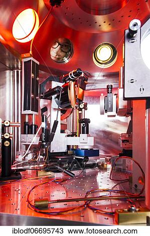 PhD student during his research work adjusting his experimental setup, laser laboratory of Prof. Georg Pretzler's group for laser and plasma physics at Heinrich-Heine-University, Düsseldorf, North Rhine-Westphalia, Germany, Europe View Large Photo Image Stock Image - PhD student during his research work adjusting his experimental setup, laser laboratory of Prof. Georg Pretzler's group for laser and plasma physics at Heinrich-Heine-University, Düsseldorf, North Rhine-Westphalia, Germany, Europe. Fotosearch