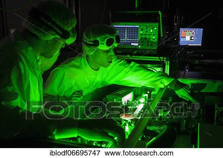 PhD student during his research work adjusting his experimental setup, laser laboratory of Prof. Georg Pretzler's working group for laser and plasma physics at Heinrich Heine University, Düsseldorf, North Rhine-Westphalia, Germany, Europe View Large Photo Image Stock Photo - PhD student during his research work adjusting his experimental setup, laser laboratory of Prof. Georg Pretzler's working group for laser and plasma physics at Heinrich Heine University, Düsseldorf, North Rhine-Westphalia, Germany, Europe. Fotosearch
