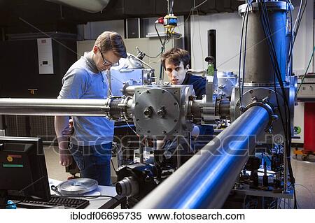 PhD student during his research work adjusting his experimental setup, laser laboratory of Prof. Georg Pretzler's working group for laser and plasma physics at Heinrich Heine University, Düsseldorf, North Rhine-Westphalia, Germany, Europe View Large Photo Image Stock Photography - PhD student during his research work adjusting his experimental setup, laser laboratory of Prof. Georg Pretzler's working group for laser and plasma physics at Heinrich Heine University, Düsseldorf, North Rhine-Westphalia, Germany, Europe. Fotosearch