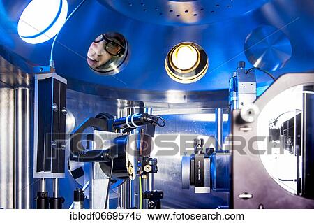 Stock Photography - PhD student during his research work adjusting his experimental setup, laser laboratory of Prof. Georg Pretzler's group for laser and plasma physics at Heinrich-Heine-University, Düsseldorf, North Rhine-Westphalia, Germany, Europe. Fotosearch