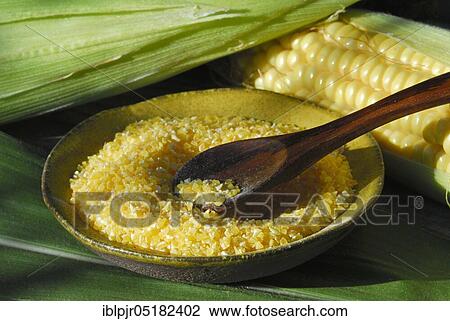 Stock Image - Polenta, maize, maize semolina, maize semolina, corn on the corn corn corn corn corn corn corn corn corn cob, maize flour, husk, wooden spoon. Fotosearch