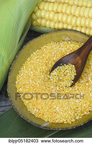 Stock Image - Polenta, maize, maize semolina, maize semolina, corn on the corn corn corn corn corn corn corn corn corn cob, maize flour, husk, wooden spoon. Fotosearch