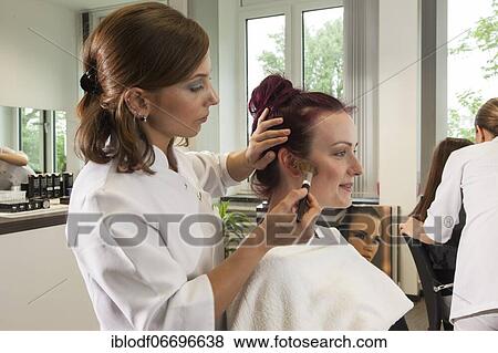 Stock Photo - Practical training as a beautician with a vocational baccalaureate at the Elly-Heuss-Knapp-Schule, Berufskolleg der Stadt Düsseldorf, North Rhine-Westphalia, Germany, Europe. Fotosearch