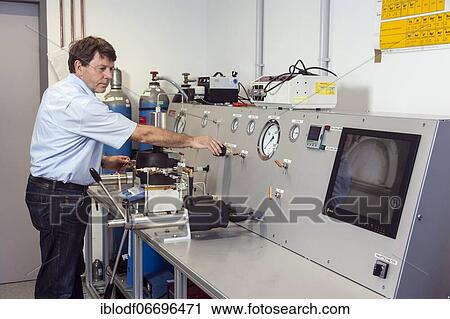 Stock Image - Prof. Dr. Ulrich Schreiber at the high-pressure machine for simulating conditions deep in the earth for research on the origin of life, Faculty of Biology, Department of Geology, Laboratory at the University of Duisburg-Essen, Essen, Germany, Europe. Fotosearch